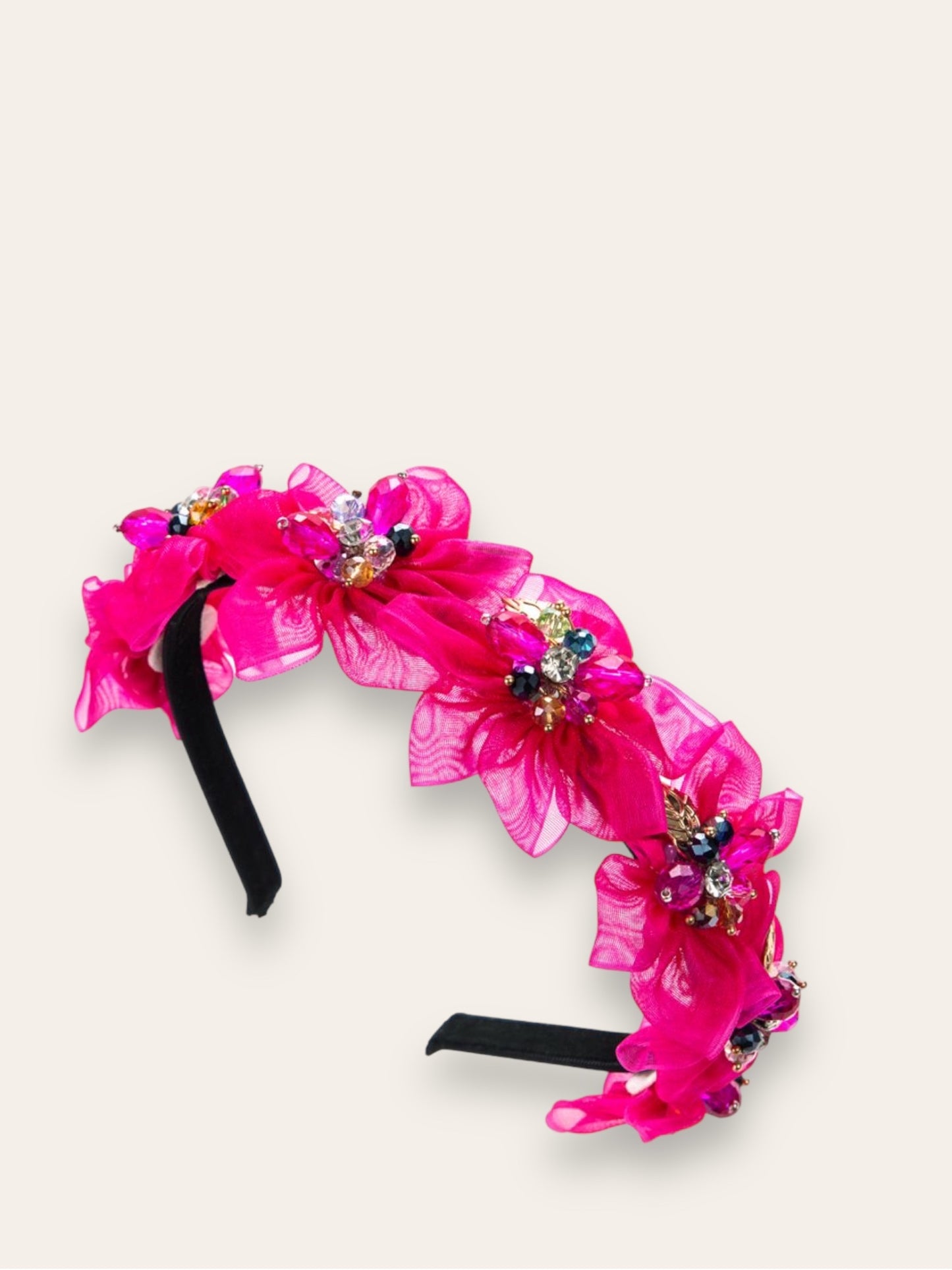 Diadema negra con flores fucsia